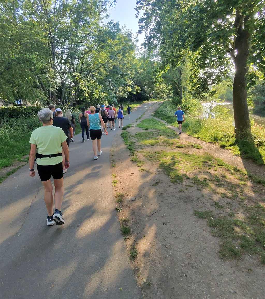 CRWC runners on a tree-lined path in Pittville Park